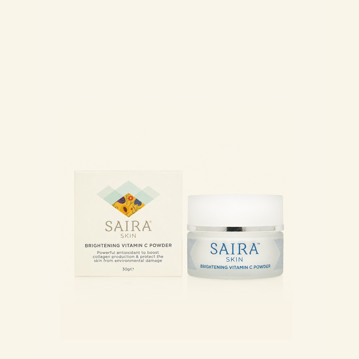Saira Skin Brightening Vitamin C Powder shown with its white outer box and a frosted glass jar with a white lid on a light cream background.