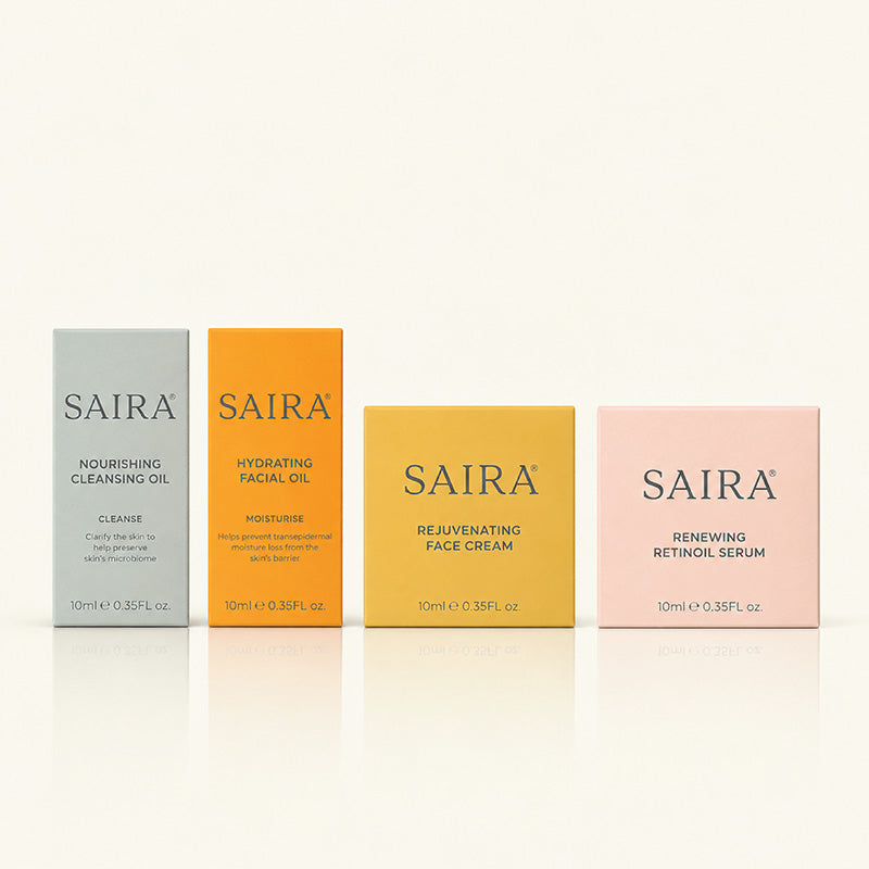 Four Saira skincare product boxes arranged in a row on a clean white background: pale blue cleansing oil, orange facial oil, yellow face cream, and pale pink Retinoil serum.